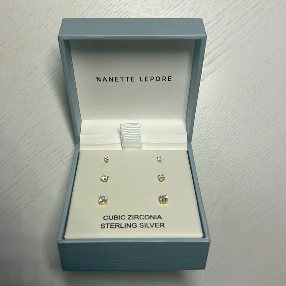 Trio of zirconia studs. Silver plated gold. Nanette Lepore